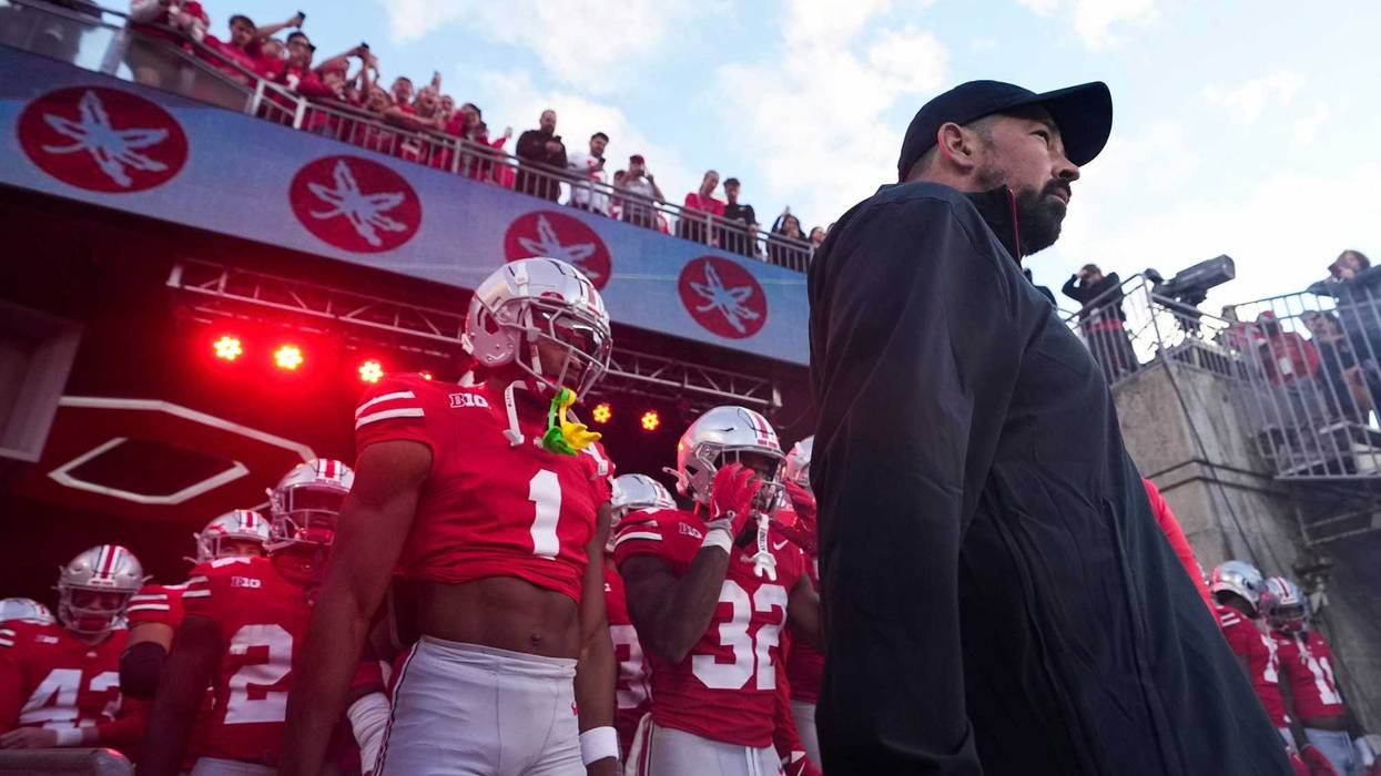 Ohio State Buckeyes cornerback Davison Igbinosun (1) and head coach Ryan Day prepare to take the field prior to the NCAA football game against the Western Michigan Broncos at Ohio Stadium.