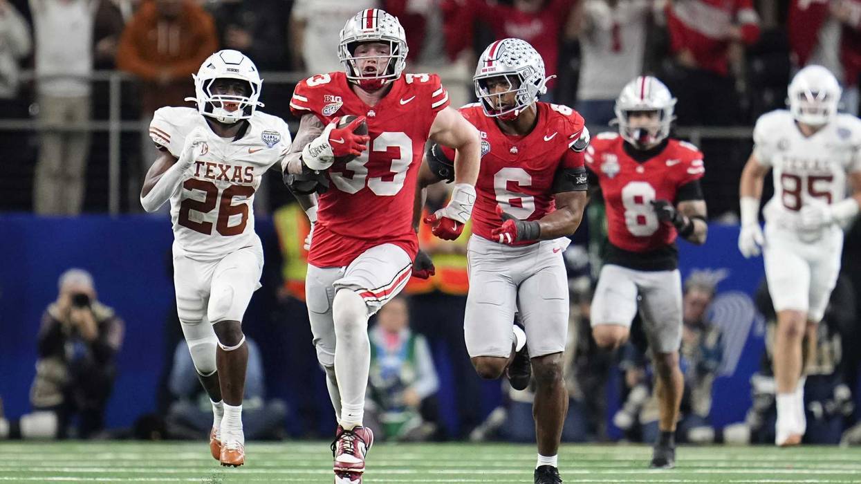 Ohio State Buckeyes defensive end Jack Sawyer (33) returns a fumble recovery for a touchdown after sacking Texas Longhorns quarterback Quinn Ewers (3) during the second half of the Cotton Bowl Classic College Football Playoff semifinal game at AT&T Stadium in Arlington, Texas on Jan. 10, 2025. Sawyer returned the fumble for a touchdown, and Ohio State won 28-14.