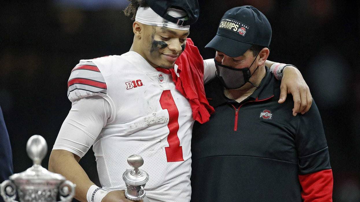 Ohio State Buckeyes head coach Ryan Day and quarterback Justin Fields share a moment after Fields was awarded the Most Outstanding Player award after beating Clemson Tigers 49-28 in the College Football Playoff semifinal at the Allstate Sugar Bowl in the Mercedes-Benz Superdome in New Orleans on Friday, Jan. 1, 2021.