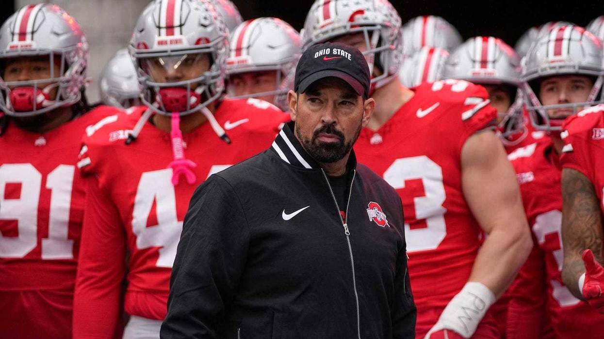 Ohio State Buckeyes head coach Ryan Day leads his team onto the field during the NCAA football game against the Indiana Hoosiers