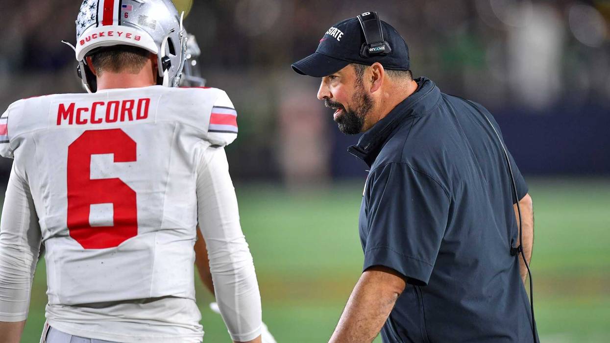 Ohio State Buckeyes head coach Ryan Day talks to quarterback Kyle McCord (6) in the game against the Notre Dame Fighting Irish at Notre Dame Stadium.