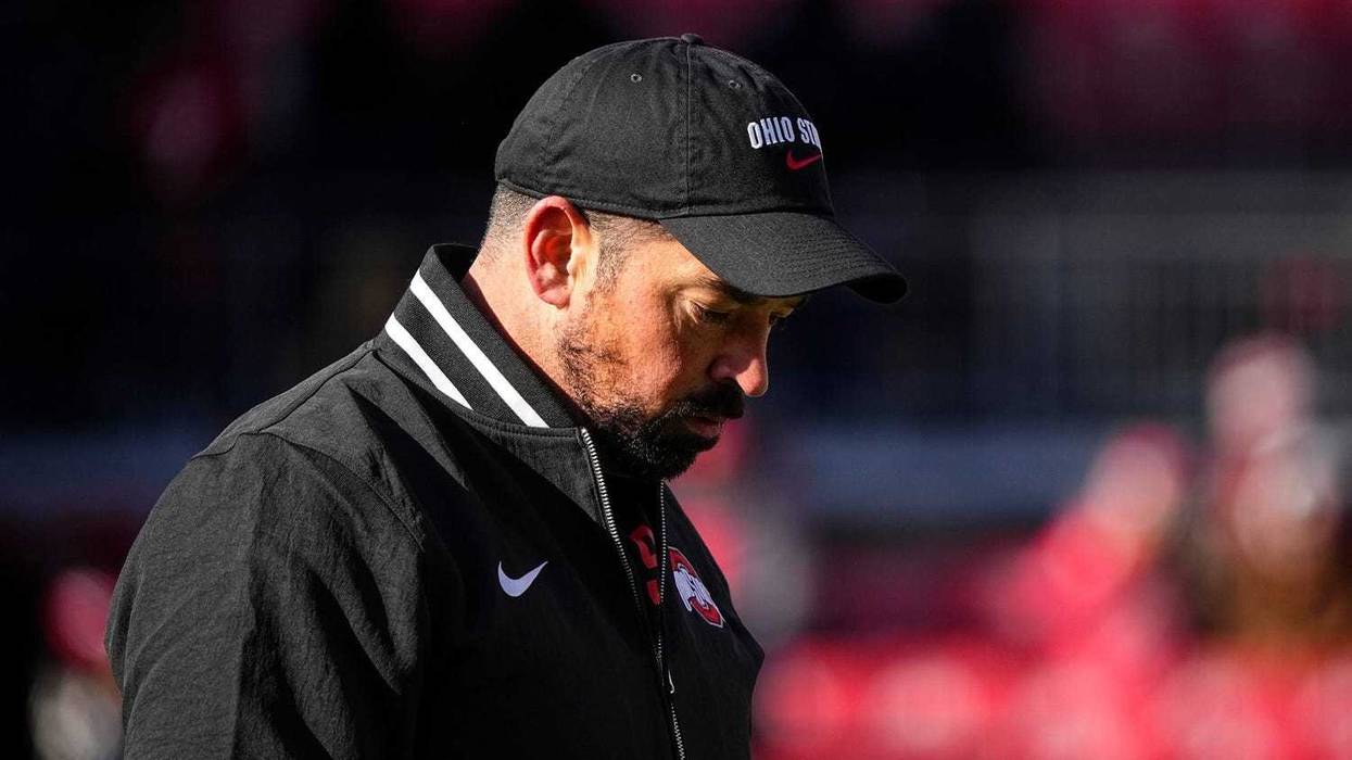 Ohio State Buckeyes head coach Ryan Day watches warm ups prior to the NCAA football game against the Michigan Wolverines at Ohio Stadium in Columbus on Tuesday, Dec. 3