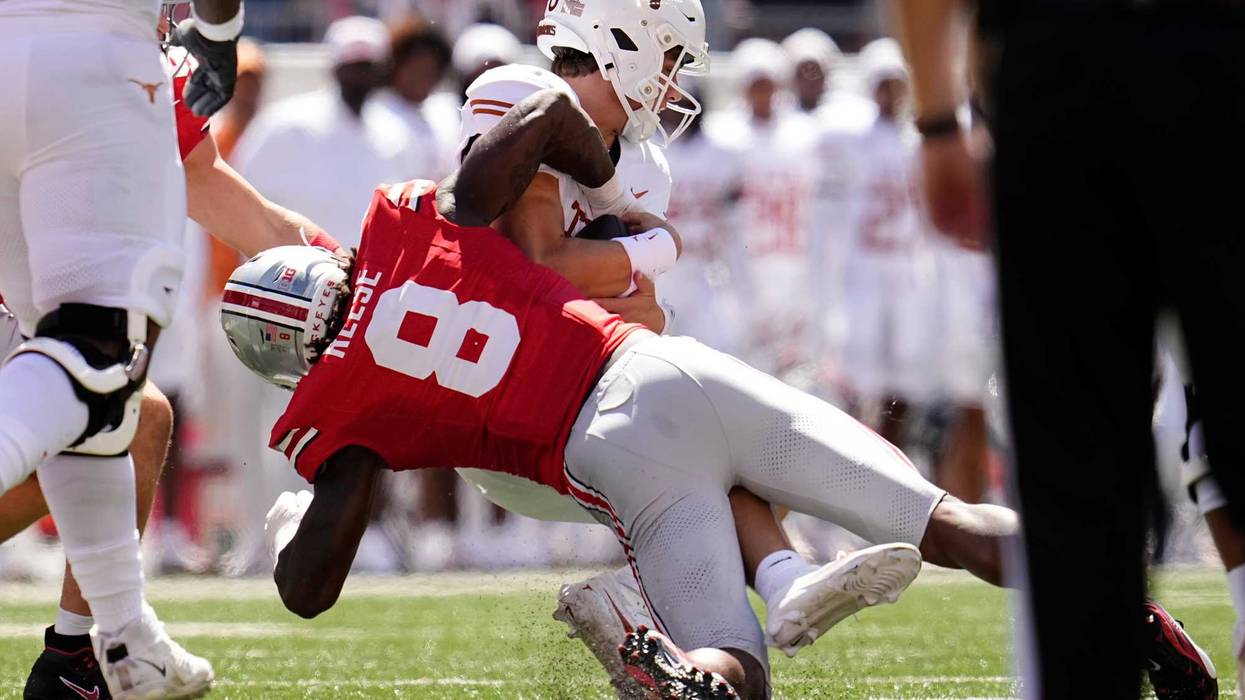 Ohio State Buckeyes linebacker Arvell Reese (8) tackles Texas Longhorns quarterback Arch Manning (16) during the NCAA football game at Ohio Stadium on Aug. 30, 2025.