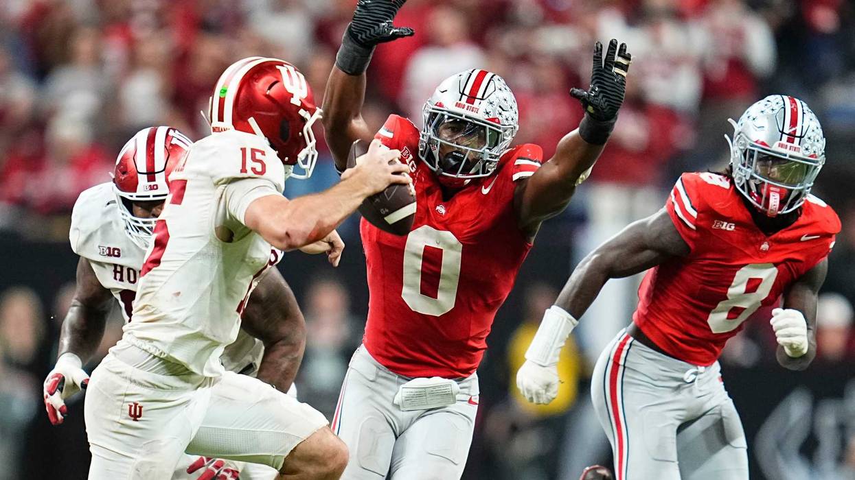 Ohio State Buckeyes linebacker Sonny Styles (0) pressures Indiana Hoosiers quarterback Fernando Mendoza (15) during the Big Ten Conference championship game at Lucas Oil Stadium in Indianapolis on Dec. 6, 2025. Ohio State lost 13-10.