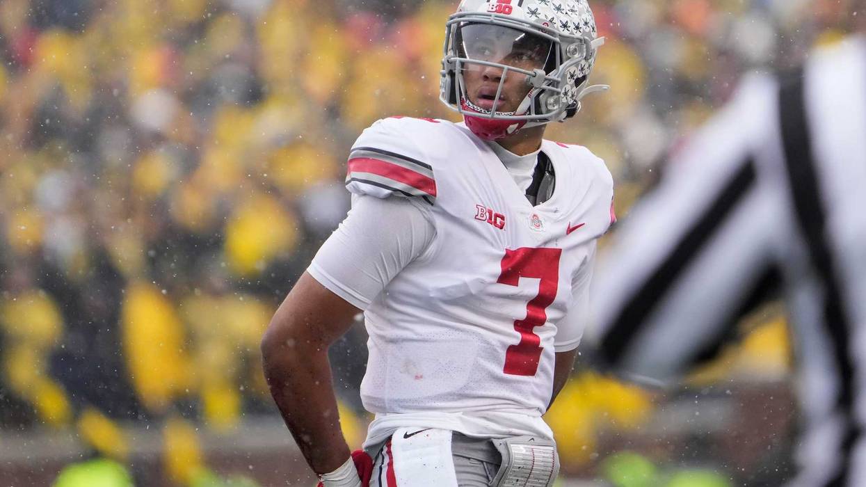 Ohio State Buckeyes quarterback C.J. Stroud (7) walks off the field during the second quarter of the NCAA football game at Michigan Stadium in Ann Arbor on Saturday, Nov. 27, 2021.