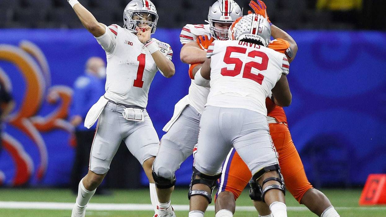 Ohio State Buckeyes quarterback Justin Fields (1) throws the ball against Clemson Tigers in the third quarter during the College Football Playoff semifinal at the Allstate Sugar Bowl in the Mercedes-Benz Superdome in New Orleans on Friday, Jan. 1, 2021.