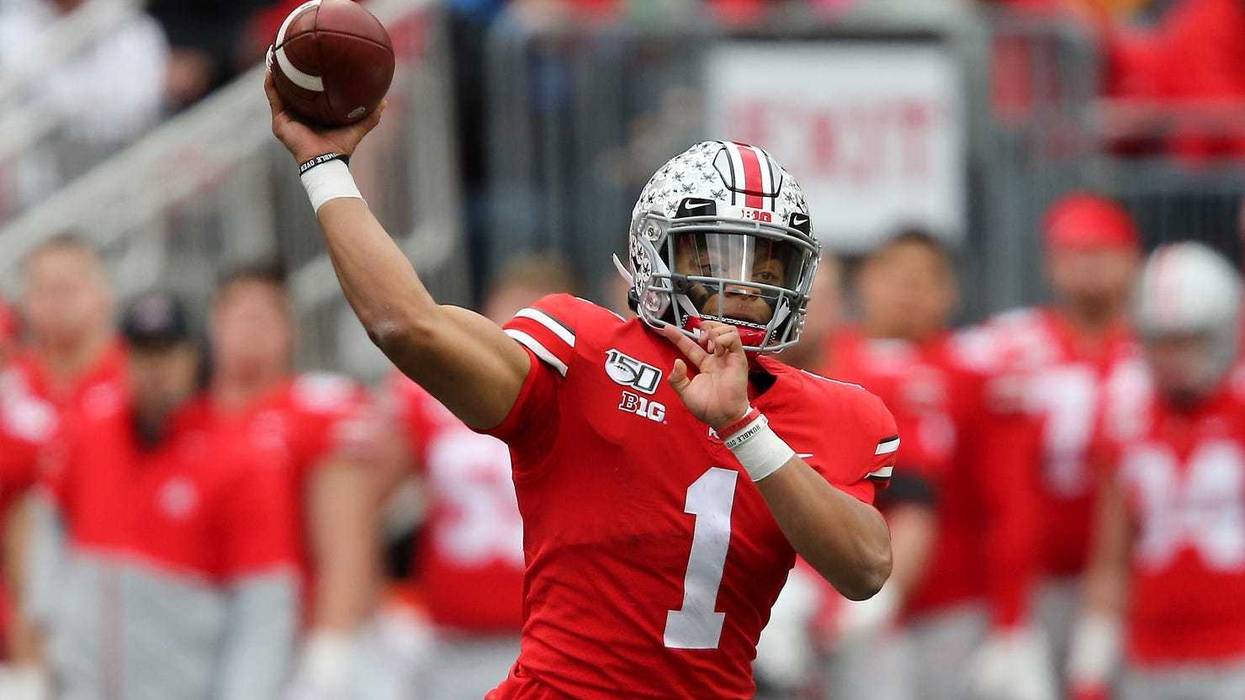 Ohio State Buckeyes quarterback Justin Fields drops to throw during the second quarter against the Penn State Nittany Lions at Ohio Stadium.
