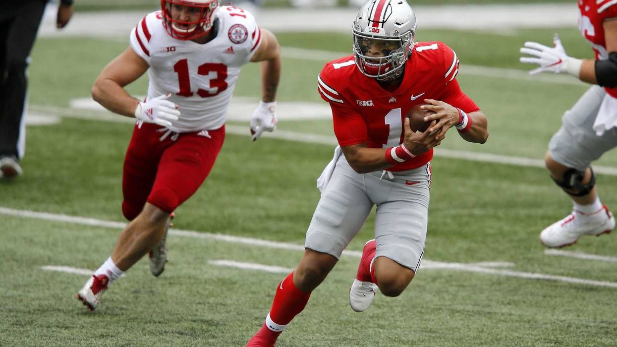 Ohio State Buckeyes quarterback Justin Fields runs during the first quarter against the Nebraska Cornhuskers at Ohio Stadium.