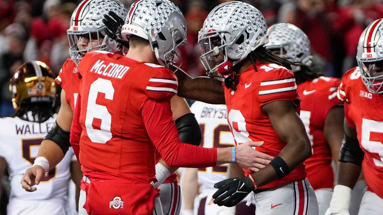 Ohio State Buckeyes quarterback Kyle McCord (6) and wide receiver Marvin Harrison Jr. (18) celebrate a touchdown connection during the NCAA football game against the Minnesota Golden Gophers at Ohio Stadium.