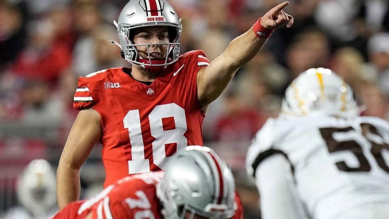 Ohio State Buckeyes quarterback Will Howard (18) motions during the second half of the NCAA football game against the Western Michigan Broncos at Ohio Stadium.