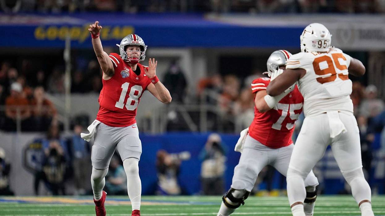 Ohio State Buckeyes quarterback Will Howard (18) throws a pass during the first half of the Cotton Bowl Classic College Football Playoff semifinal game against the Texas Longhorns at AT&T Stadium in Arlington, Texas on Jan. 10, 2025.