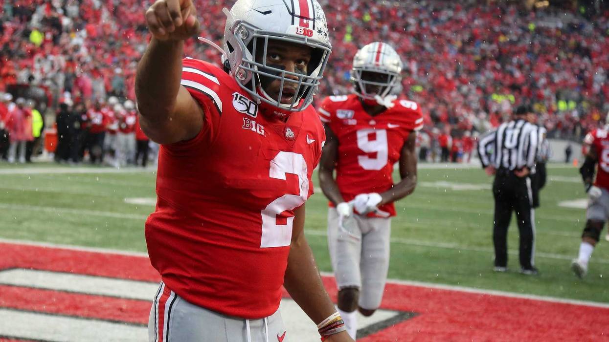 Ohio State Buckeyes running back J.K. Dobbins (2) scores a touchdown during the third quarter against the Wisconsin Badgers at Ohio Stadium.