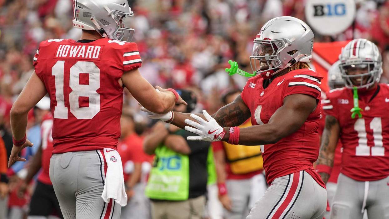 Ohio State Buckeyes running back Quinshon Judkins (1) celebrates scoring a touchdown with quarterback Will Howard (18) during the NCAA football game against the Akron Zips at Ohio Stadium.
