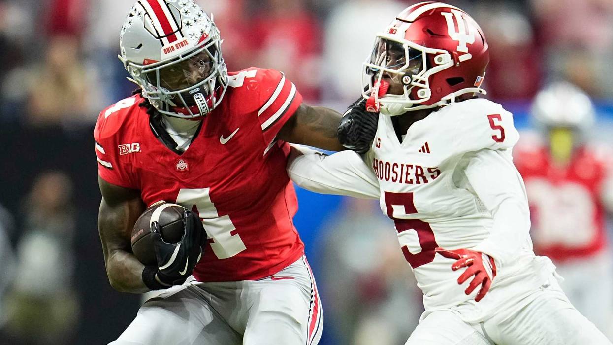Ohio State Buckeyes wide receiver Jeremiah Smith (4) shakes off Indiana Hoosiers defensive back D'Angelo Ponds (5) during the Big Ten Conference championship game at Lucas Oil Stadium in Indianapolis on Dec. 6, 2025. Ohio State lost 13-10.