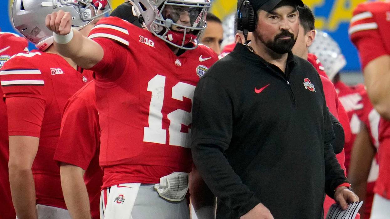 Ohio State quarterback Lincoln Kienholz talks to coach Ryan Day during the Cotton Bowl on Dec. 29.