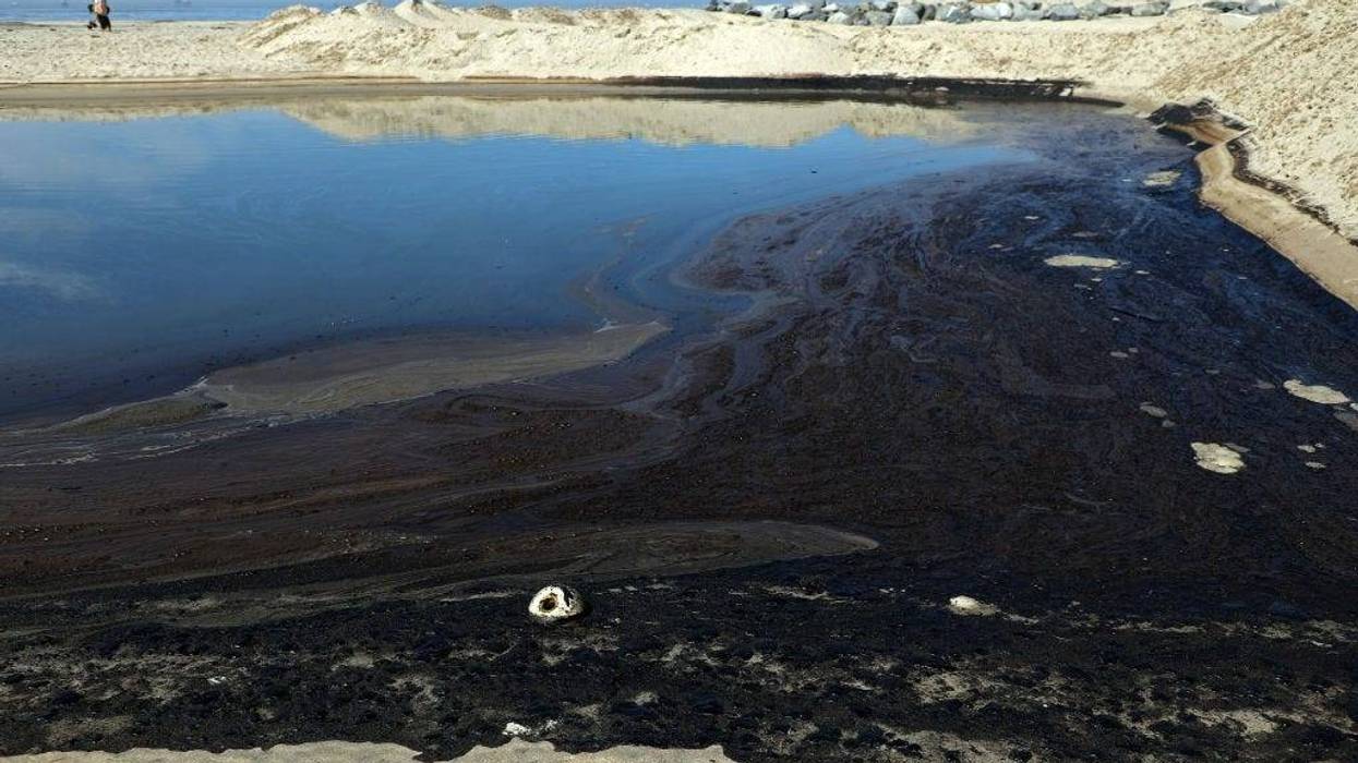 Oil and sea water collect in a tide pool after a 25,000-gallon oil spill from an offshore oil platform on October 3, 2021, in Newport Beach, Calif.