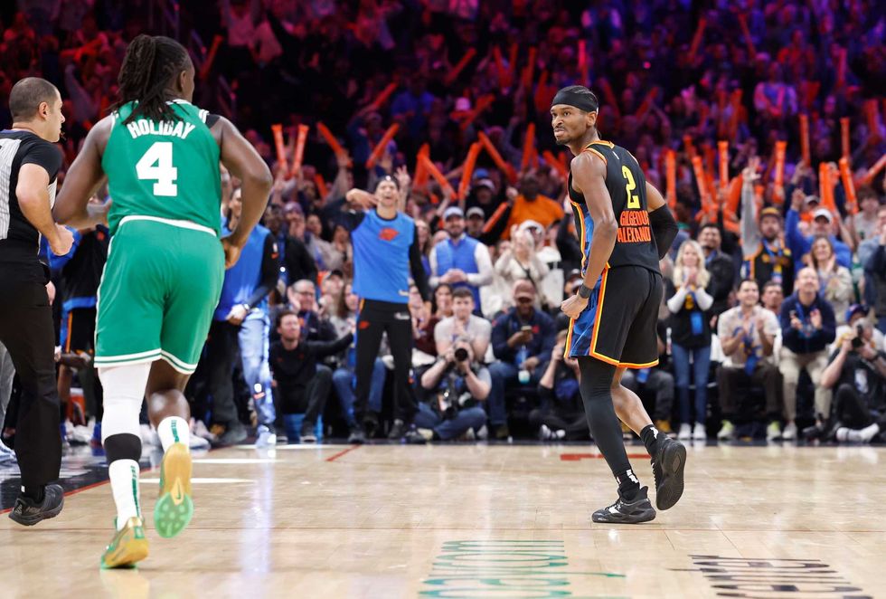 Oklahoma City Thunder guard Shai Gilgeous-Alexander (2) reacts after scoring against the Boston Celtics during the fourth quarter at Paycom Center.