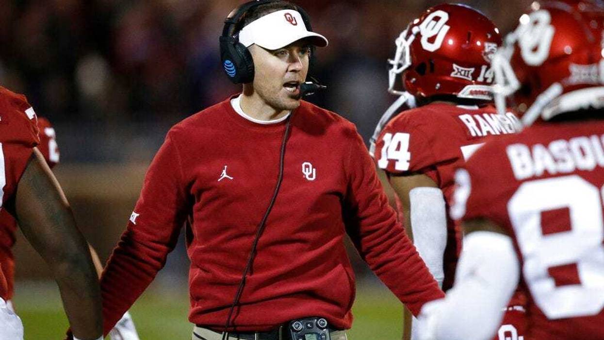 Oklahoma head coach Lincoln Riley greets players as they return to the sideline after scoring in the first half of an NCAA college football game against TCU in Norman, Okla., Saturday, Nov. 23, 2019.
