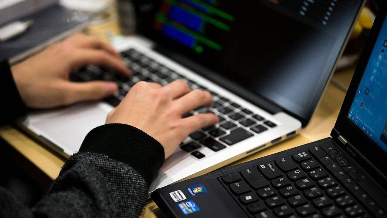 OKYO, JAPAN - JANUARY 28: A participant uses a laptop computer as he takes part in the Seccon 2016 final competition on January 28, 2017 in Tokyo, Japan. 24 teams from Japan, the US, China, Taiwan, South Korea, Russia, Poland, Switzerland and France compe