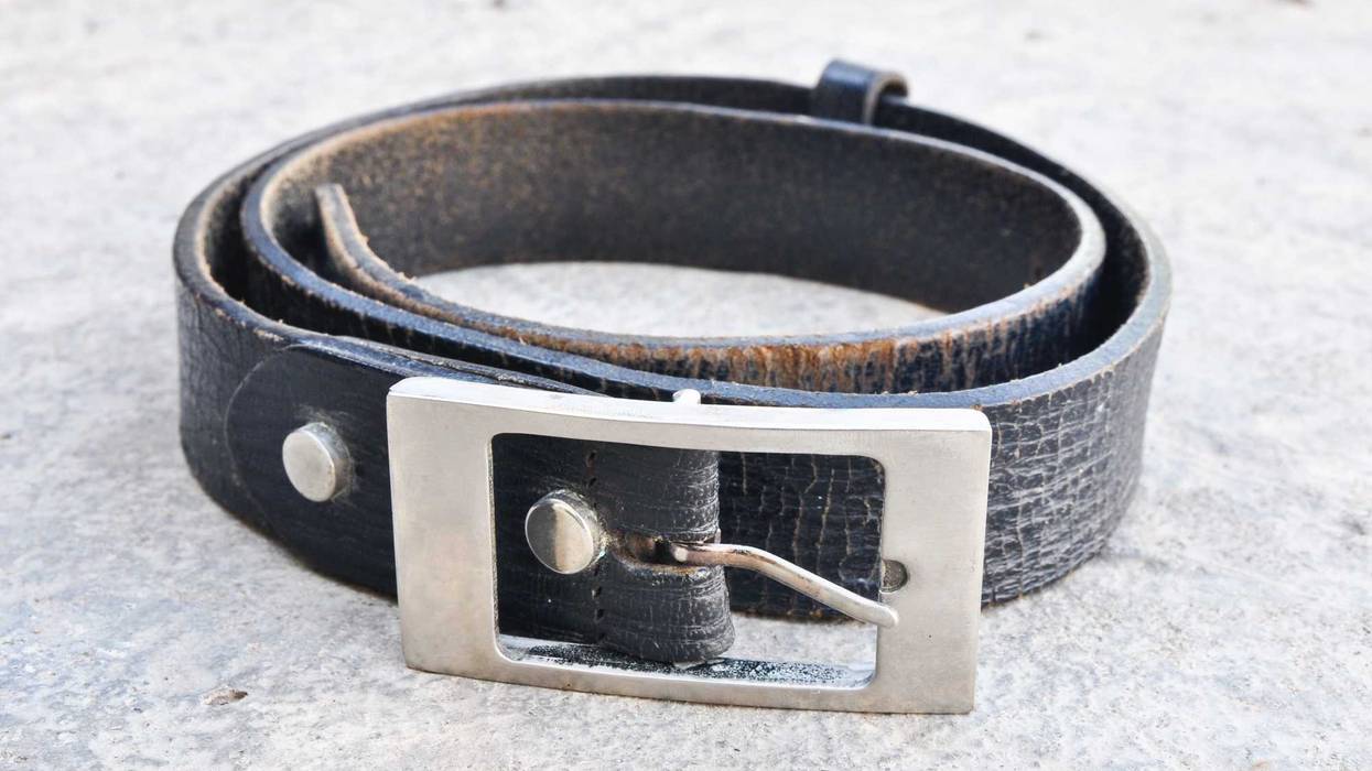 Old dog collar on the ground.