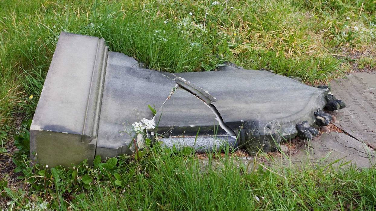 "Old gravestone in churchyard cemetry, fallen over and smashed in half. Location is Knutsford, Cheshire, UK."