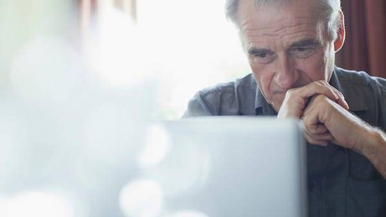 Old man staring at computer