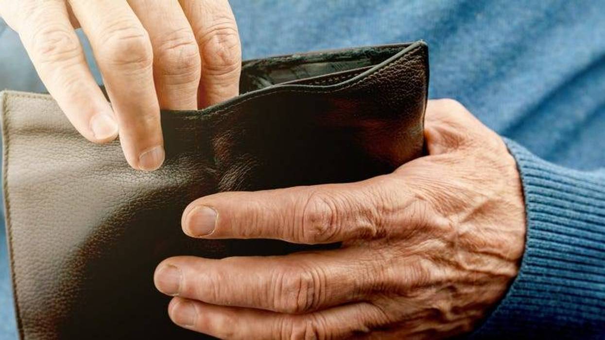 older man with wallet