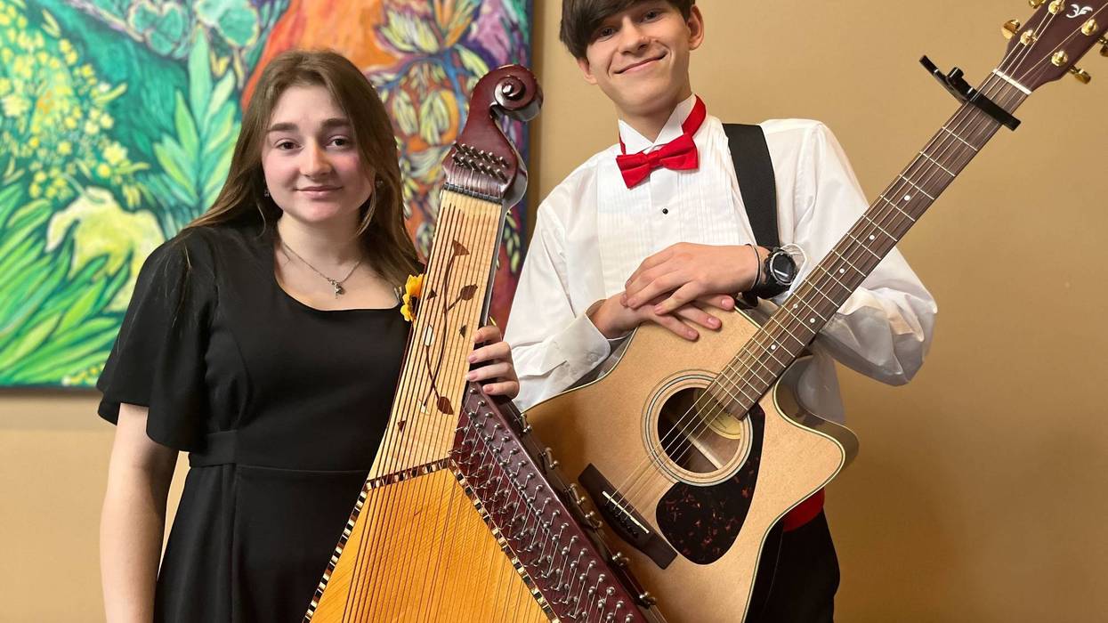Olesia Skorets and David Kozyrkov, performers with the String Theory Charter School marking one year since Russia's invasion of Ukraine.