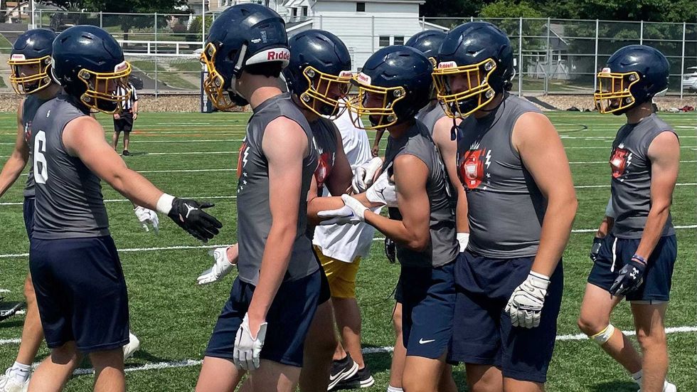 Olmsted Falls High School football players celebrate a play during the Deshaun Watson Foundation Inaugural High School 7-on-7 tournament at Archbishop Hoban High School