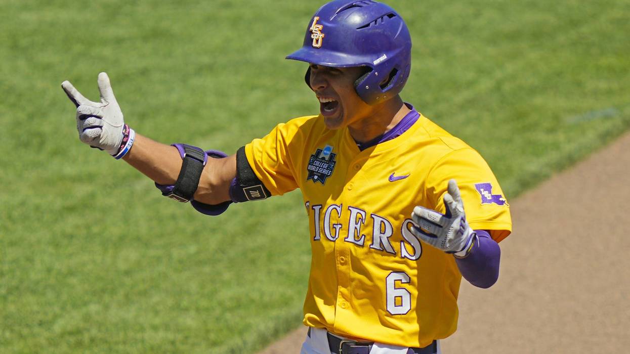 OMAHA, NEBRASKA - JUNE 22 2025: Derek Curiel #6 of the LSU Tigers celebrates after hitting an RBI single during the fourth inning against the Coastal Carolina Chanticleers in Game 2 of the NCAA College World Series baseball finals at Charles Schwab Field on June 22, 2025 in Omaha, Nebraska.
