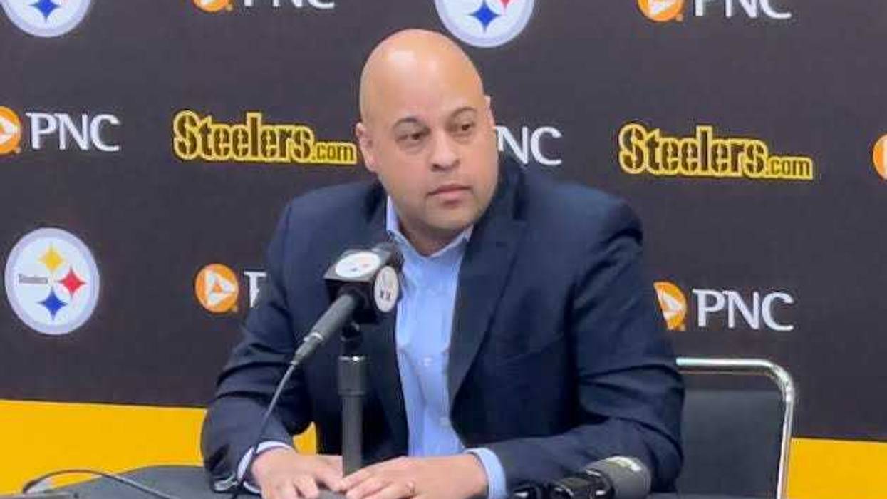 Omar Khan at a podium