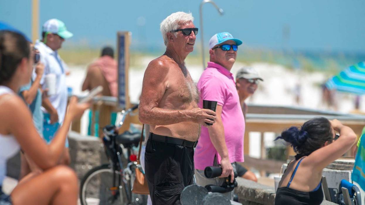 On-lookers keep a eye out for the return of SpaceX's Crew Dragon at Pensacola Beach Sunday, August 2. 2020. This was the first water landing by NASA since 1975. Spacex Crew Dragon Return 10
