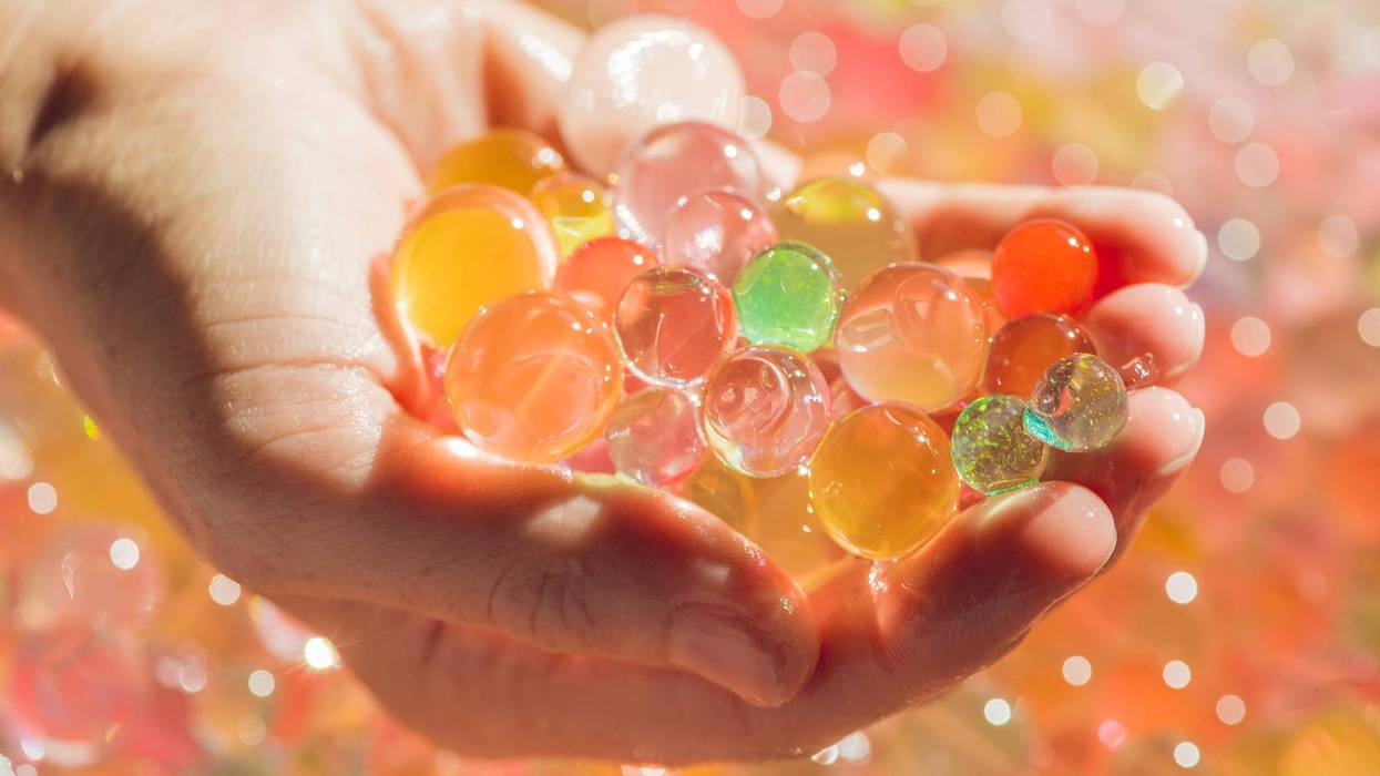 One adult and one juvenile have been charged in connection to firing Orbeez balls at a crowd of people standing in line outside an ice cream shop in Dearborn on March 17.