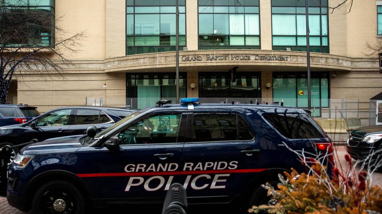 One man is dead and three police officers are on administrative leave after a mid-day shootout broke out between cops and a murder suspect in West Michigan on Thursday.