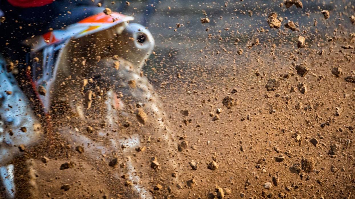 One man is hospitalized with a serious head injury after he crashed into a vehicle stopped at a mailbox while riding his dirt bike in St. Clair County on Thursday.