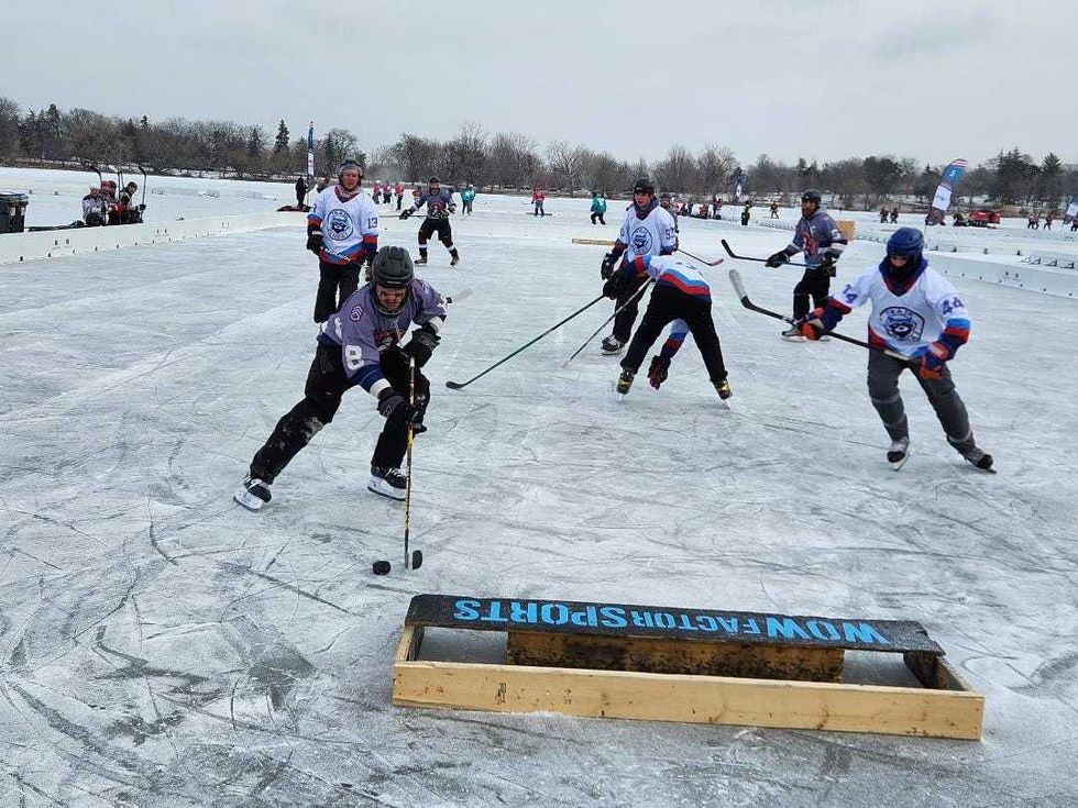 One of the first goals is scored at the US Pond Hockey Championships