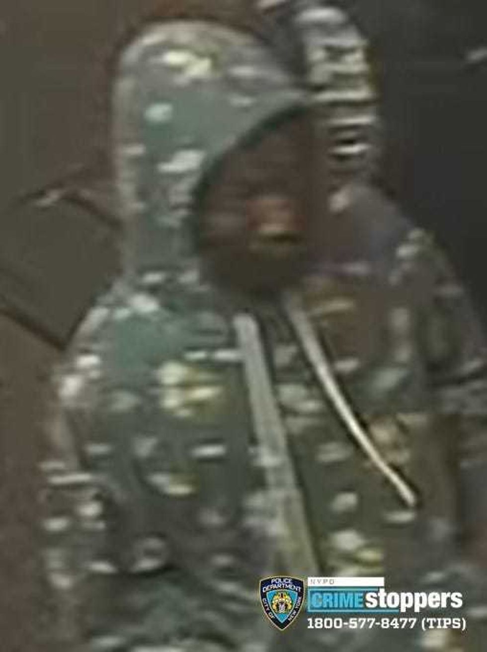 One of the individuals being sought in relation to a robbery.