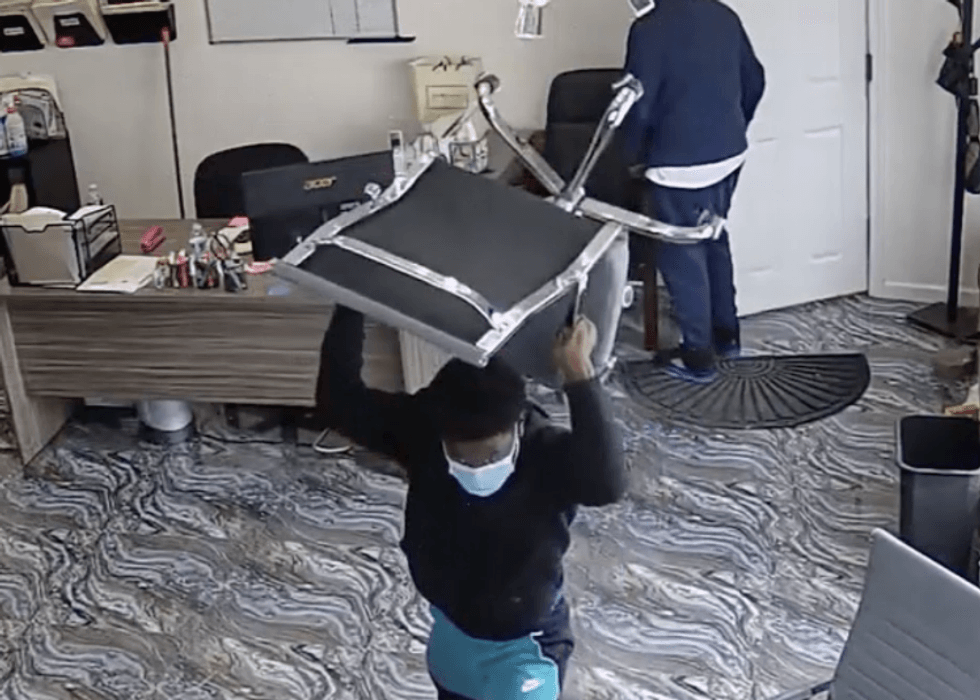 One of the men threw a chair during the caught-on-camera attack.