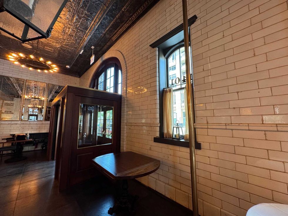 One of the original fire poles at the entrance of the former firehouse