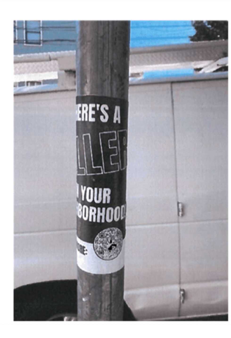 One of the stickers wrapped around a pole.