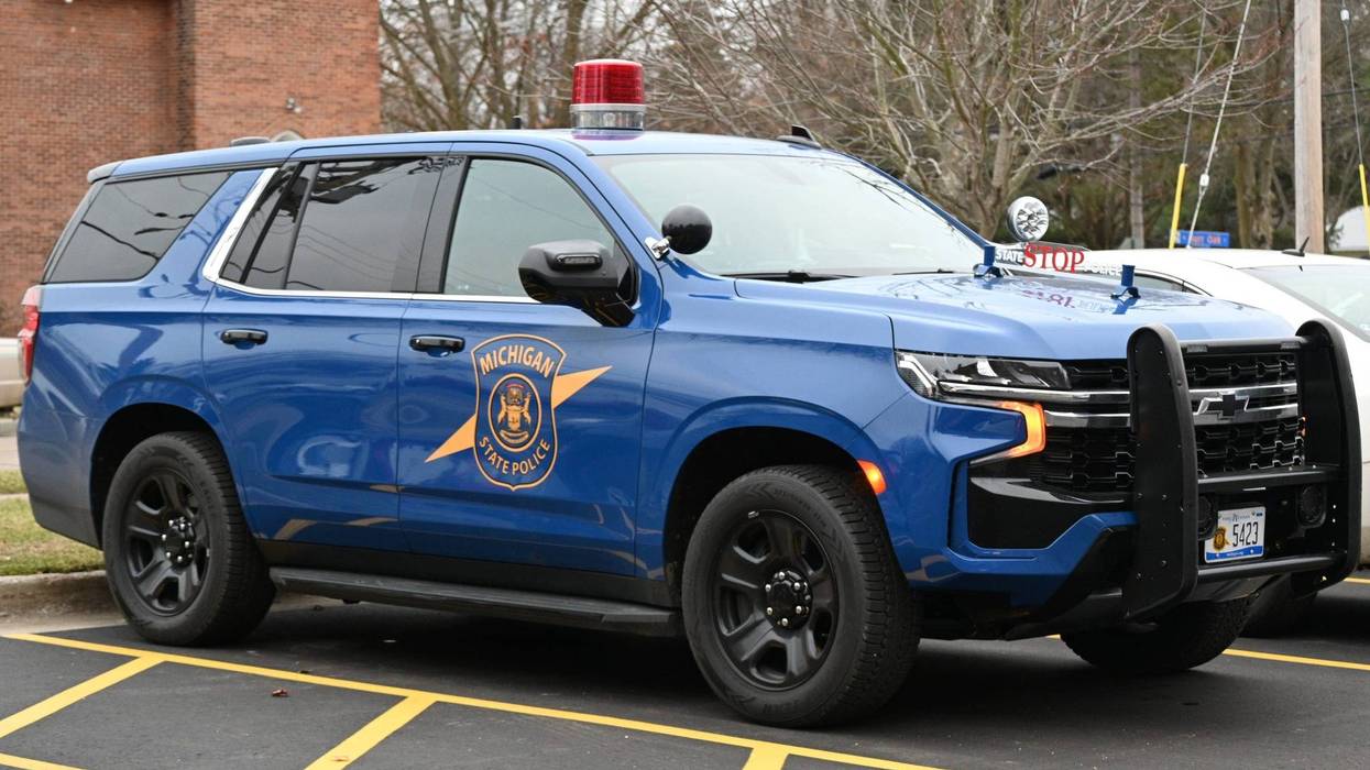 One woman is dead after a speeding driver without a license collided into her vehicle and struck her as she stood outside of it on I-96 in Detroit on Saturday morning.