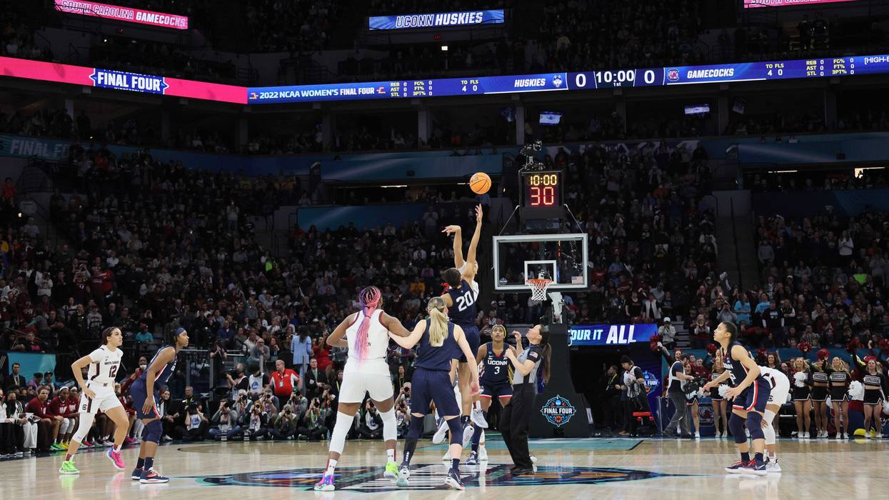 Opening jump ball of thee 2022 NCAA women's basketball national championship game, featuring UConn and South Carolina, at Minneapolis, 4/3/22
