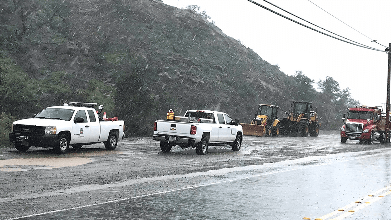 Orange County Public Works crews staged with equipment near the Bond Fire burn area on March 28, 2022, amid heavy rain with the potential for flooding in Silverado, Modjeska and Williams Canyons.