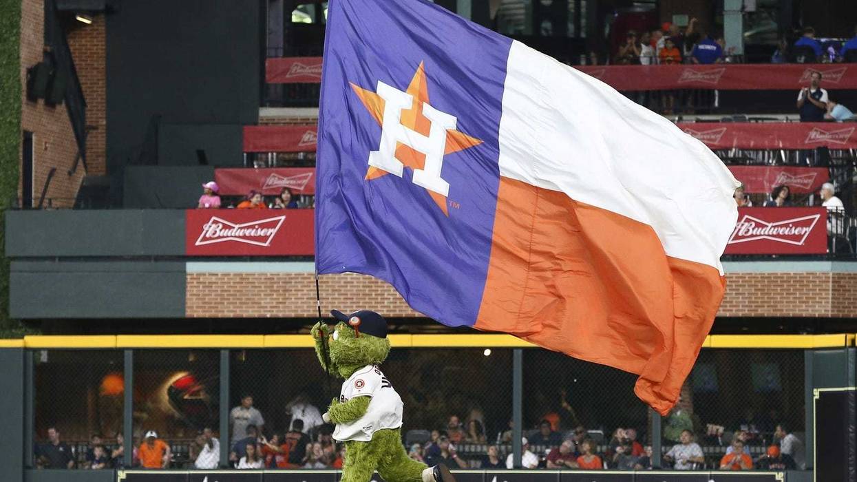 Orbit runs the Astros flag