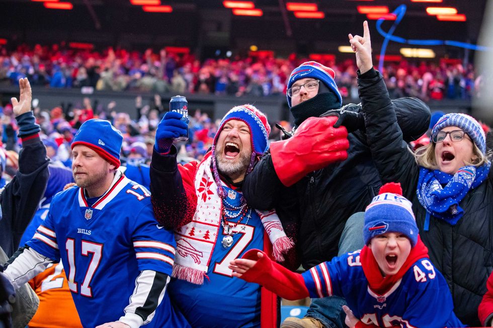 ORCHARD PARK, NY - NOVEMBER 24: Buffalo Bills fans celebrate a review resulting in a touchdown for the Buffalo Bills during the fourth quarter against the Denver Broncos at New Era Field on November 24, 2019 in Orchard Park, New York. Buffalo defeats Denver 20-3. (Photo by Brett Carlsen/Getty Images)