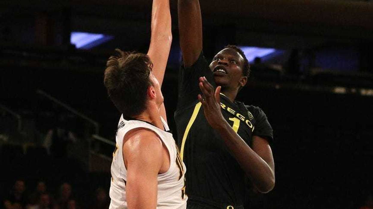 Oregon Ducks center Bol Bol (1) shoots against Iowa Hawkeyes forward Luka Garza (55) during the second half at Madison Square Garden.