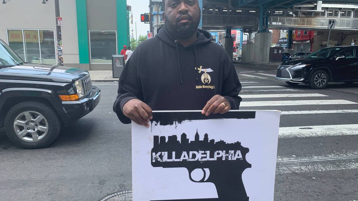 Oronde McCain protecting gun violence at 52nd and Market in West Philadelphia.