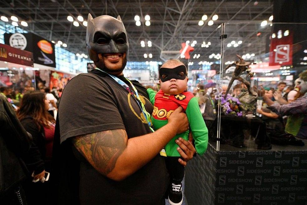 osplayers dressed as Batman and Robin attend New York Comic Con 2019 Day 3 at Jacob K. Javits Convention Center.