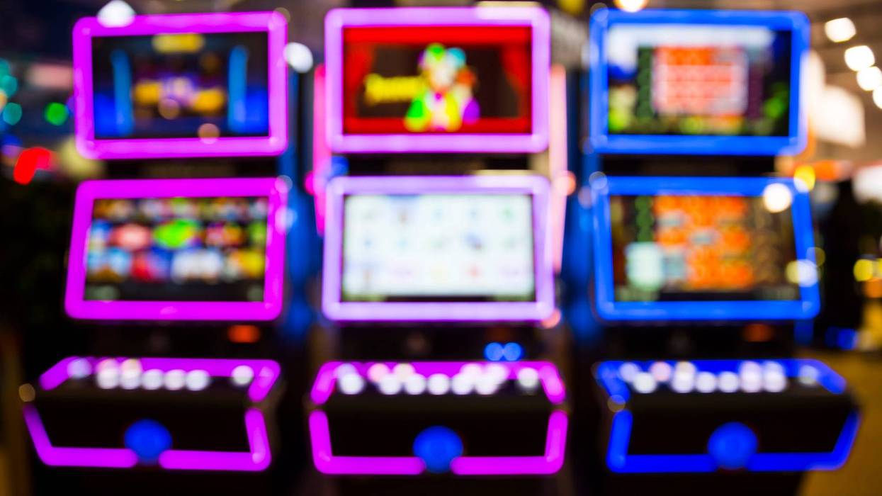 Out of focus blurry image of casino equipment. Blurred slot machines in a casino.