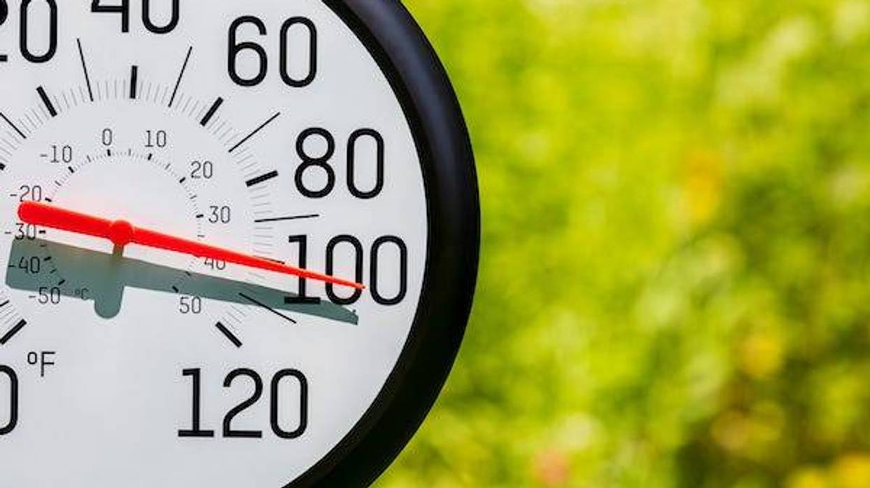 Outdoor thermometer in the sun during heatwave